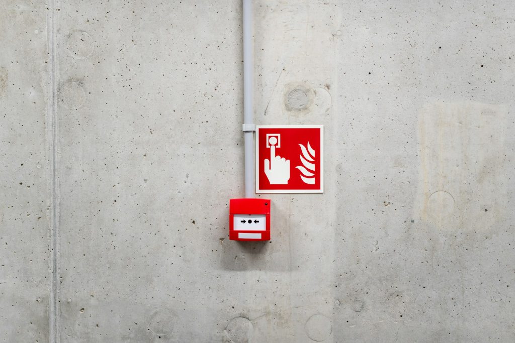 Fire alarm call point and fire action sign