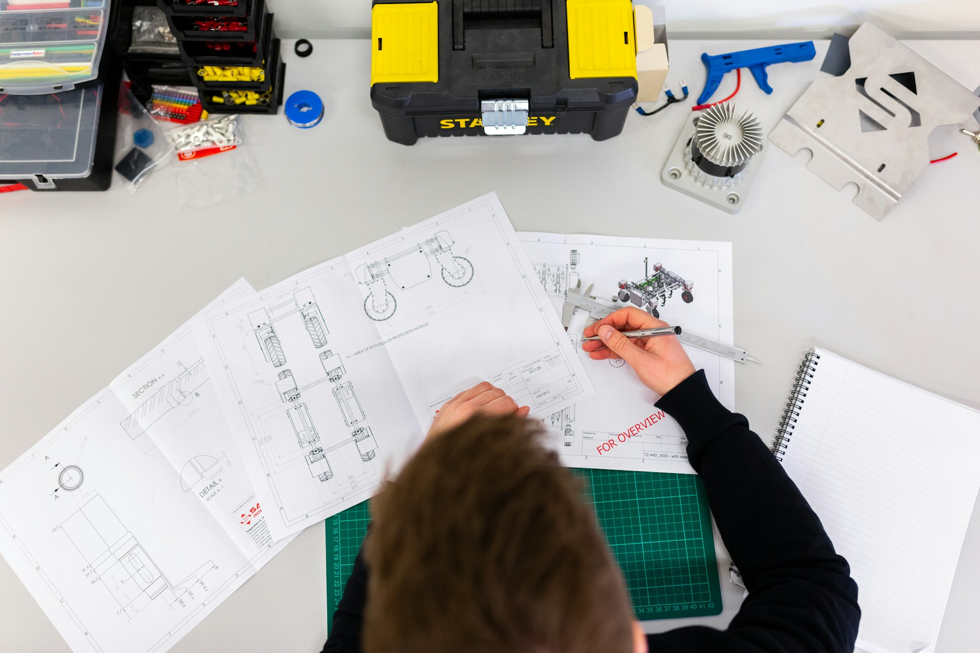 Engineer working on technical drawings