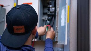 Electrician carrying out maintenance